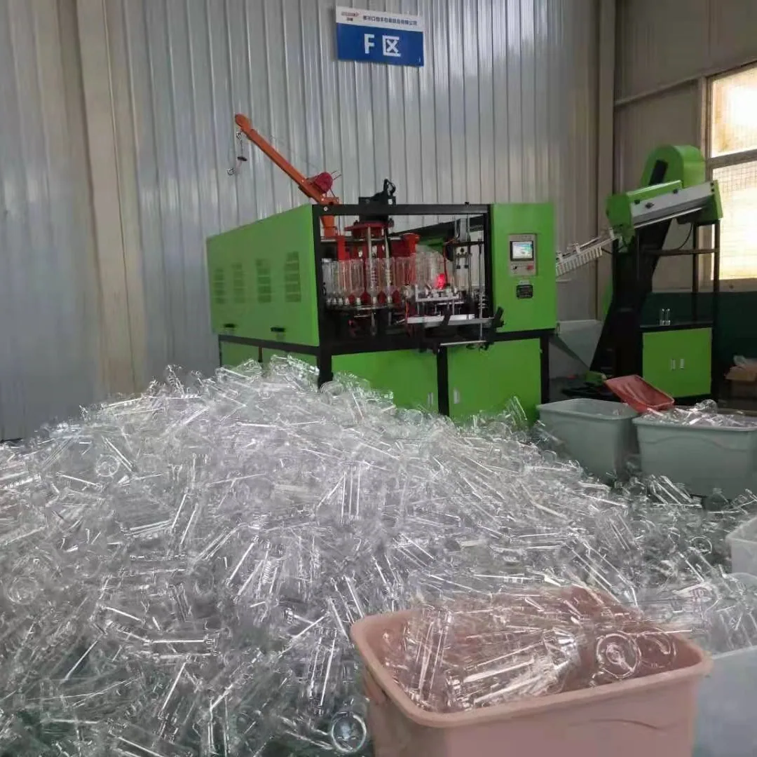Taizhou usine directe machine de moulage par soufflage de plastique bouteille de boisson ligne de production automatique un sur quatre PET à grande vitesse blo 3